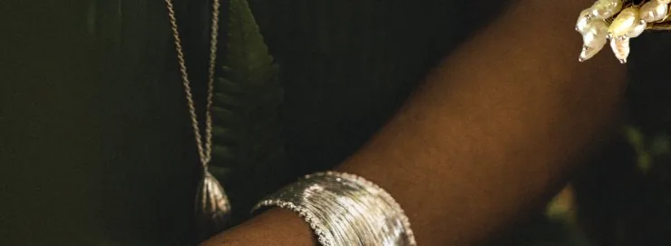 Palm cuff gold cuff bracelet worn in the forest