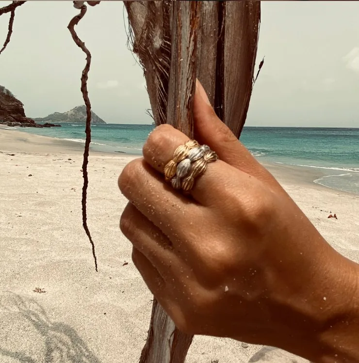 Nature inspired rings, cocoa pod stacking rings worn on the beach